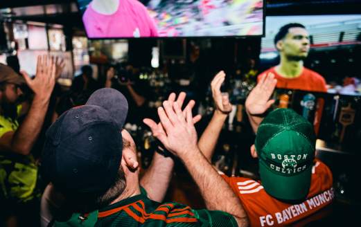 Crowd watching soccer at a Boston sports bar