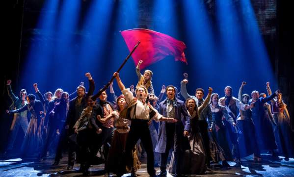 Les Misérables performers on stage
