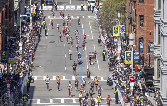 Boston marathon finishers on Hereford Street before turing onto Boylston Street