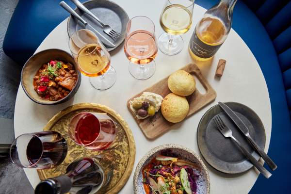 dinner table featuring food and wine