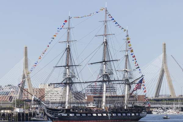 The Constitution in the Boston Harbor with the Zakim in the background