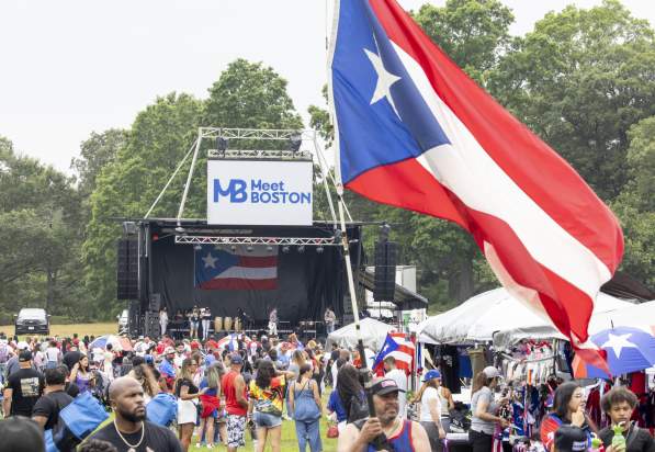 a crowd of people and stage at the Puerto Rican festival at Franklin Park