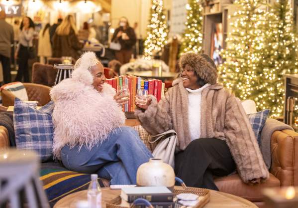 Two people enjoying the Frostival Lodge