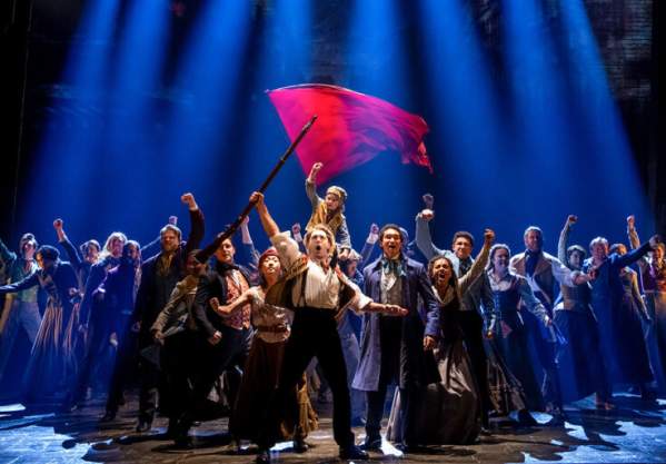 Les Misérables performers on stage
