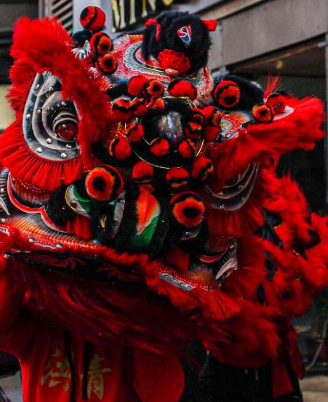 Large Red Dragon Puppet in Street During Chinese New Year Celebration in Boston