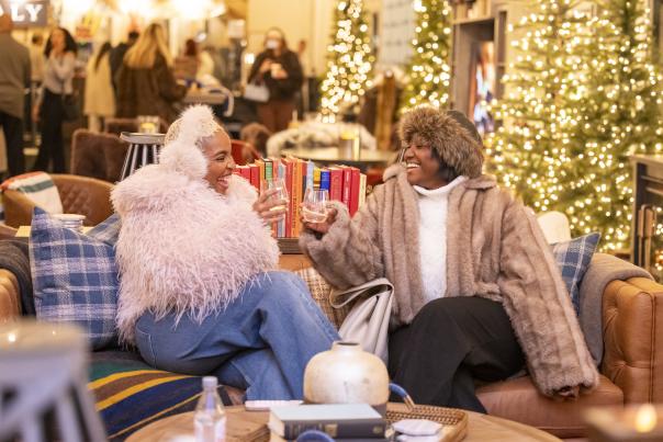 Two people enjoying the Frostival Lodge