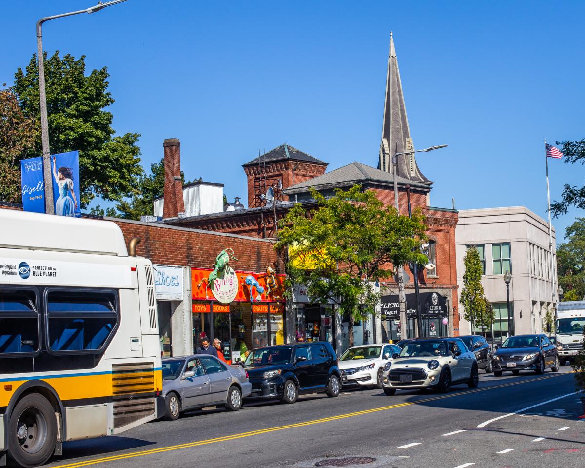 Busy street lined with cars in Jamaica Plain