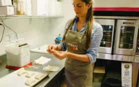 Woman Cooking At Empanada Mama