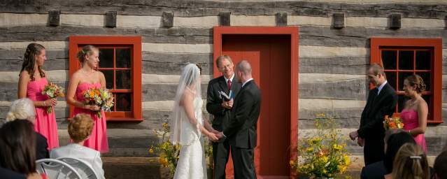 Wedding in front of Mercer Log House