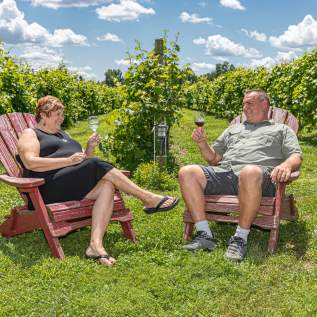 A Couple Enjoying Wine At Bishop Estate