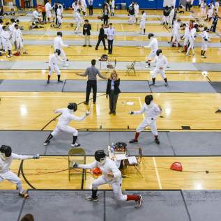 Wide shot above fencing gym