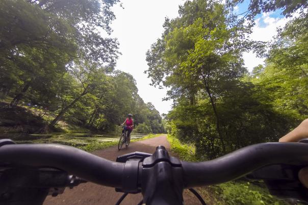 Biking the Delaware Canal woman passing Go Pro AS