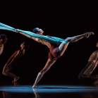 Cincinnati theater with silk curtain dancer stretching leg