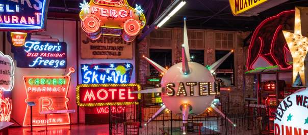 Several neon signs on display at the American Sign Museum