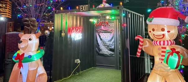 The festive entrance, guarded by 2 inflatable gingerbread men, to Covington Yard's Winter Wonderyard pop-up