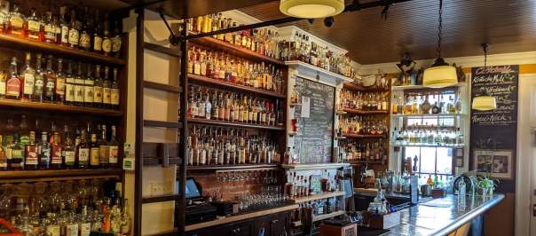 More than 700 bottles of bourbon behind the bar at Old Kentucky Bourbon Bar
