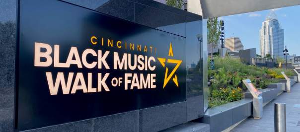 A black marble sign that says Cincinnati Black Music Walk of Fame