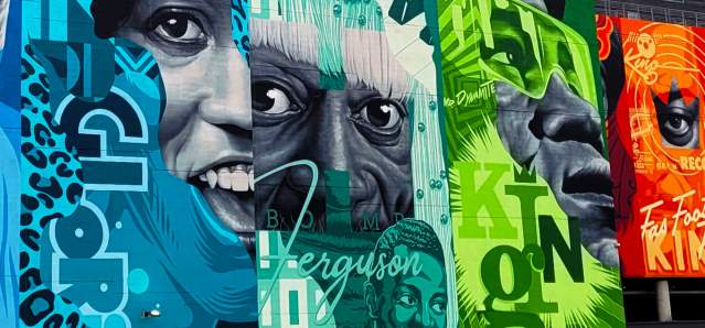 A close-up shot of the vibrant Tristan Eaton mural in downtown Cincinnati