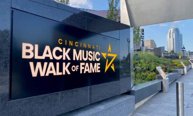 A black marble sign that says Cincinnati Black Music Walk of Fame