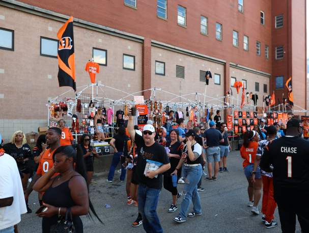 A group of Bengals fans tailgate before a game.