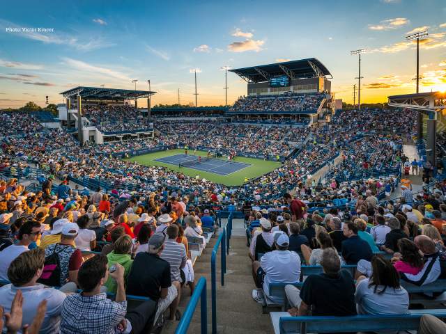 A packed arena of fans looks down at a tennis court at the Cincinnati Open