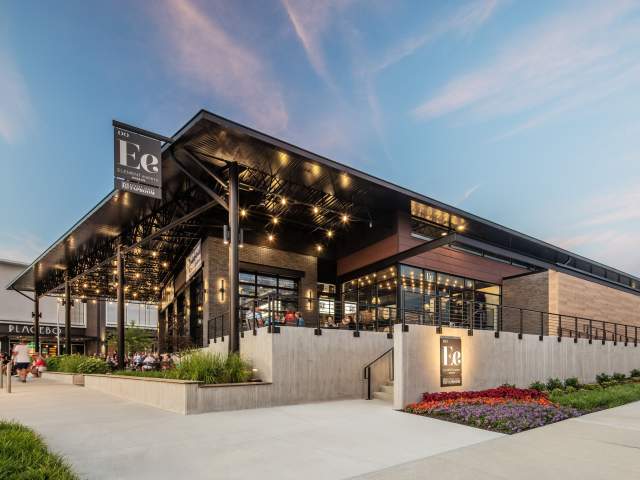 The exterior entrance of Element Eatery set against a blue sky.
