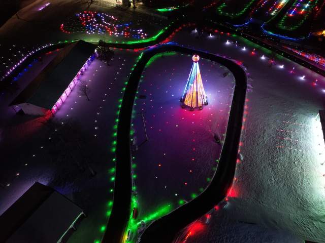 A birds eye view of the lights surrounding a driving path.