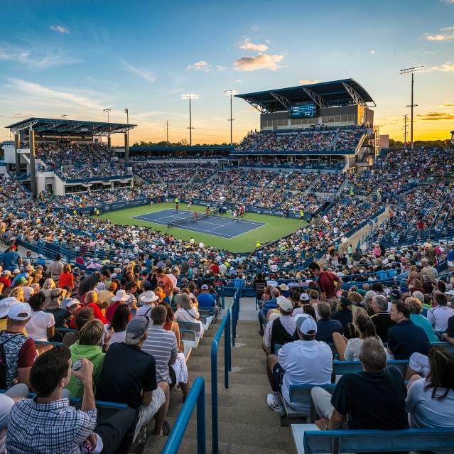 A packed arena of fans looks down at a tennis court at the Cincinnati Open