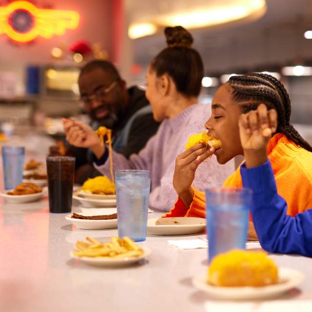 A family enjoys Cincinnati chili at Camp Washington Chili Parlor