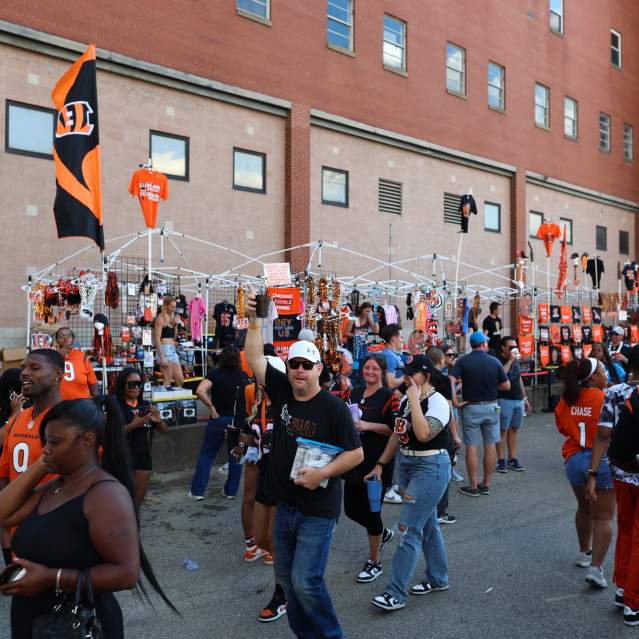 A group of Bengals fans tailgate before a game.