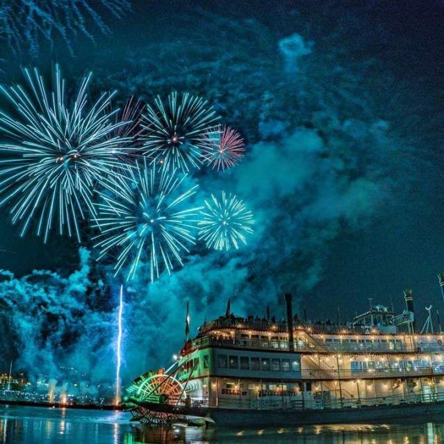 The image is of the BB Riverboat at night with fireworks in the background.