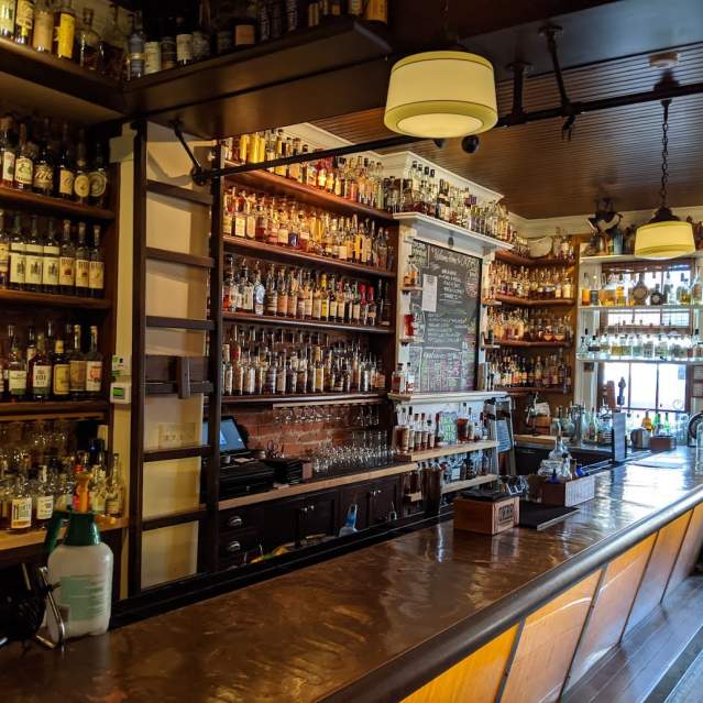 More than 700 bottles of bourbon behind the bar at Old Kentucky Bourbon Bar