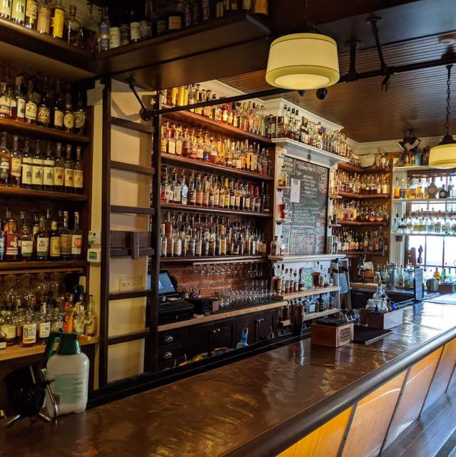 More than 700 bottles of bourbon behind the bar at Old Kentucky Bourbon Bar