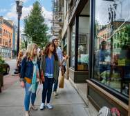 People walking down sidewalk