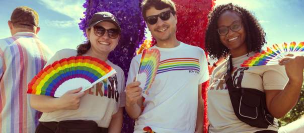 Visit Cincy employees post on a pride parade float