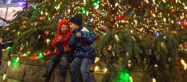 Kids enjoying the Fountain Square tree during the holidays