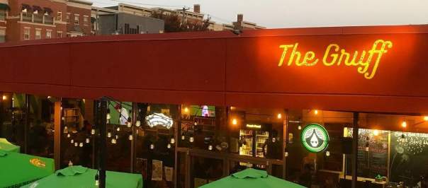 The Gruff restaurant and patio with green umbrellas in Covington, KY