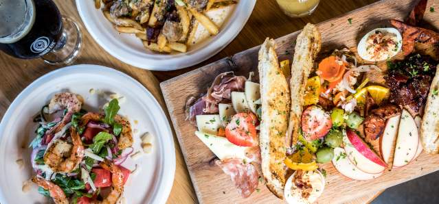 table of food and drinks spread out from Cincinnati