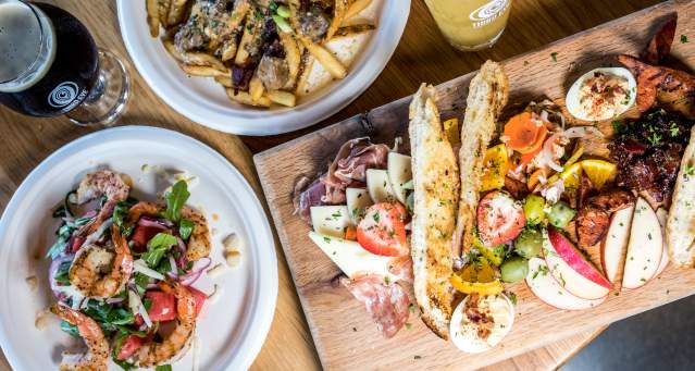 table of food and drinks spread out from Cincinnati