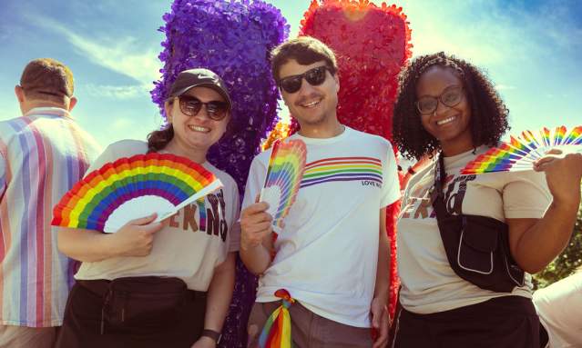 Visit Cincy employees post on a pride parade float