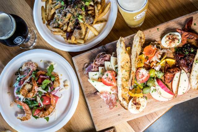 table of food and drinks spread out from Cincinnati