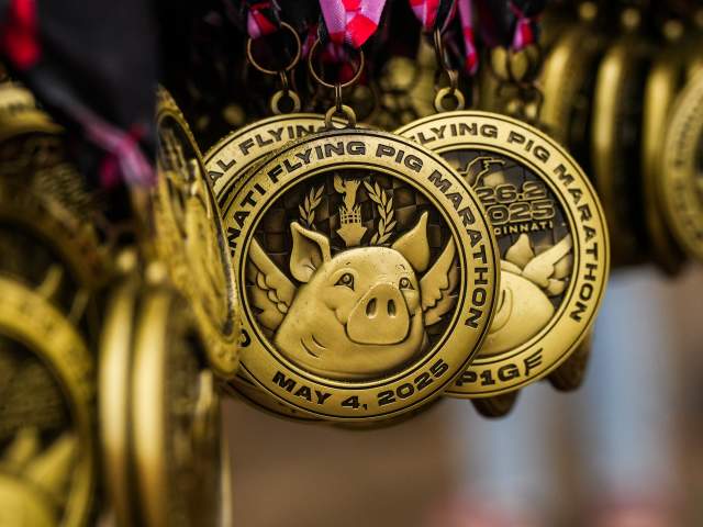A bunch of Flying Pig medals hung up at the finish swine.