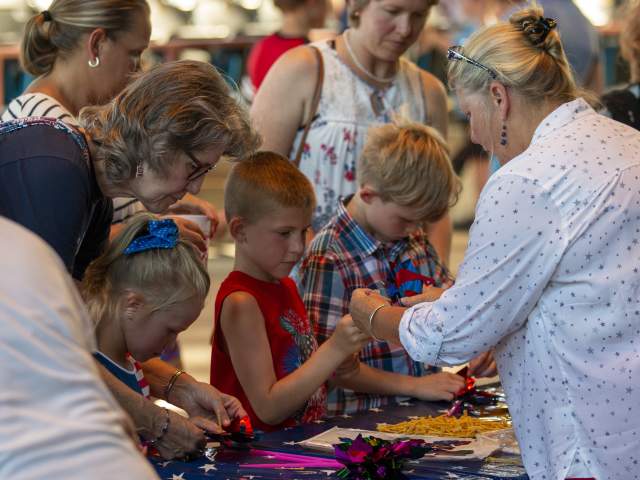 A group of children participate in crafts at Red, White and BOOM.