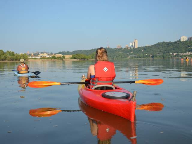 A group of people paddling on the Ohio River