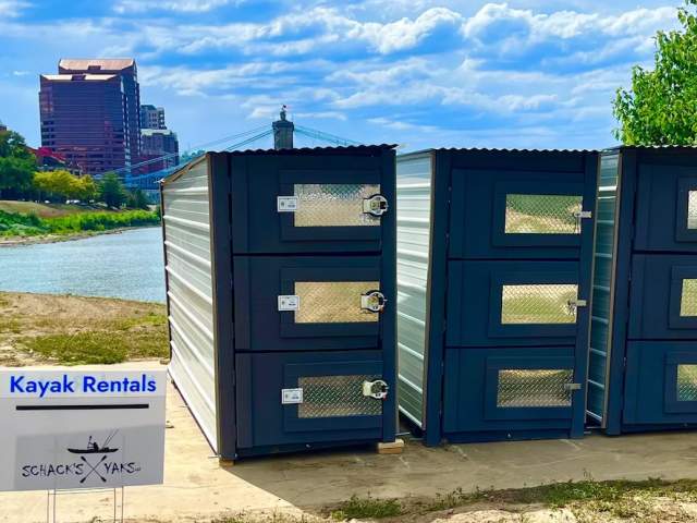 A locker/rental kiosk of kayaks