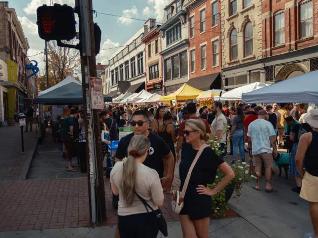 A group of people hanging out at the Cryptid Block Party in Covington.