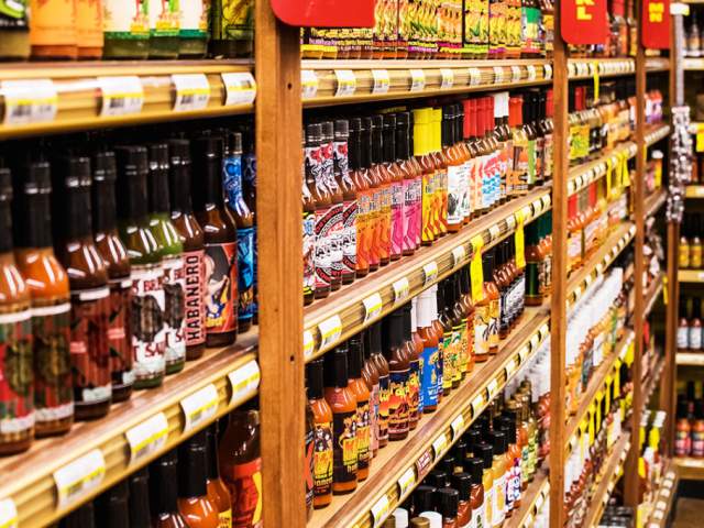 An assortment of hot sauces in an aisle at Jungle Jim's International Market.