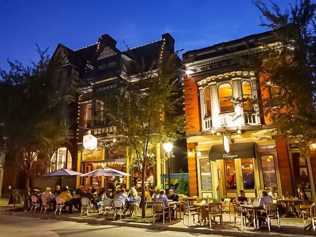 19th century buildings in Mainstrasse Village in Covington, Ky. illuminated by strings of lights and street lights.