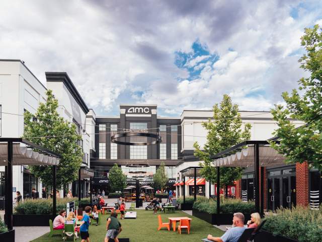The courtyard at Newport on the Levee where people sit and watch children play yard games.