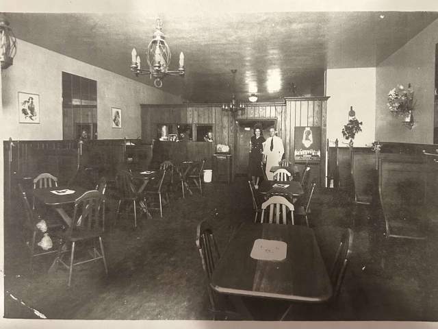 An old, black and white photograph of the Zip's Cafe dining room